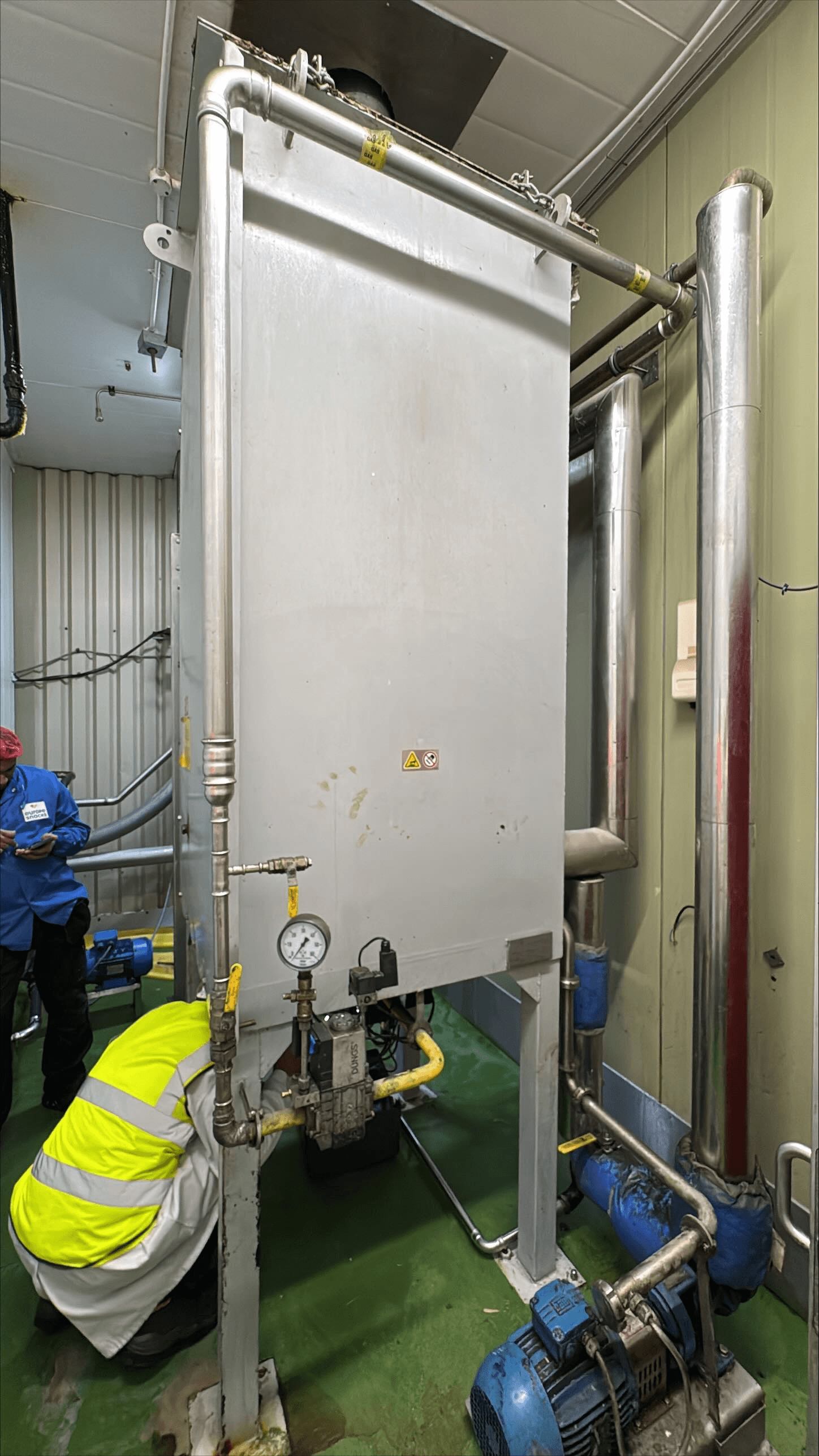 Engineers on a site walkdown mapping existing plant infrastructure