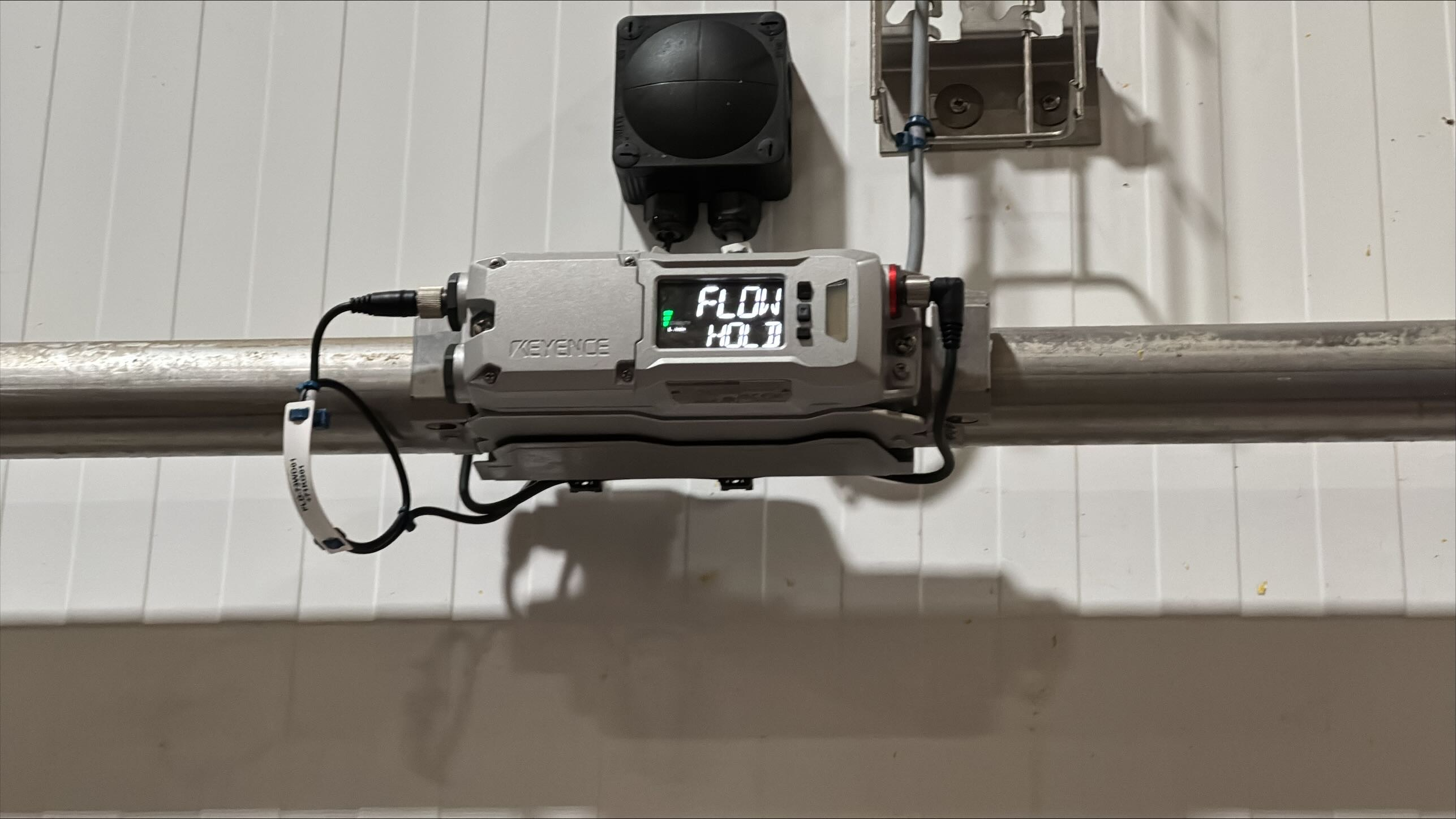 Oil flow meter installed with digital readout